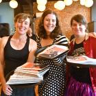 Roller derby competitors (from left) Annette King, Shanna Verhoef and Ella Strong distribute...