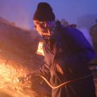 Ken Gillespie lights the bonfire at the Brass Monkey rally in 2018. Photo: Allied Press files