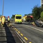 Emergency services at the scene after a car rolled in Warrender St. Photo: Gregor Richardson