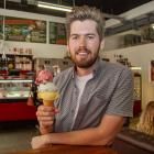 Rollickin' Gelato owner Jed Joyce with an impressive stack of gelato from his new Cashel St store...