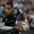Aaron Smith of the Highlanders passes during the round 3 Super Rugby match between the Brumbies...