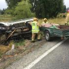 Firefighters at the scene of a single-vehicle crash in Homestead Rd, at Weston, inland from...