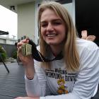 Oamaru’s Isobel Ryan shows off her 100m backstroke Mountain West conference swimming gold medal...