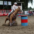 Oamaru’s Chloe Ruddle (12) guides her horse around a barrel in the junior barrel race at the...