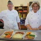 St Kevin's College kitchen site manager Laney Millar and chef Bruce Millar with some of the meals...