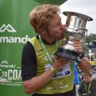 Sam Clark (Whakatane) kisses the world cup of multisport after winning the 243km Longest Day...