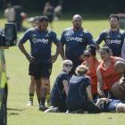 Players, team supporters and medical staff tend to injured Islanders player Reita Puatolo at...