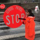 Crossing patrol volunteer Iris, a senior pupil at North East Valley Normal School, with the new...