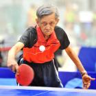 Gerard Lucas is all motion in a table tennis match at the masters games at the Edgar Centre...