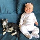 Taz, formerly Brighton, with his youngest human sister, Ella Rose. Photo: Supplied