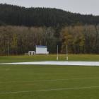 The pitch block at the University Oval was under cover yesterday. Wet weather has left the area...