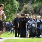 Kiliona Tupai (left) and Waikahutia-Tamati Tupaim perform the wero, or challenge, as visitors are...