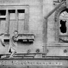 Police photographer Constable W. Halliday, takes official pictures at the scene of the big...