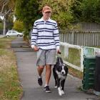 Cole Mercer from Shirley walks his dog Max, a border collie/huntaway cross on Hills Rd. Photo:...