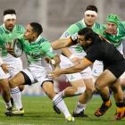 Aaron Smith of Highlanders evades a tackle from Agustin Creevy of Jaguares during a match between...