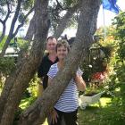 Alan and Carolyn Eagle in their Dunedin garden, which is dominated by a massive southern rata. 