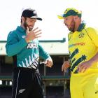 Captains Kane Williamson (left) and Aaron Finch react after accidentally shaking hands prior to...