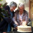 Pat, Lady Mark and Olive, Lady Hutchins cut the cake at the 50th anniversary celebrations of the...