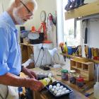 Retired zoologist and Lake Wanaka marina grebes project founder John Darby with the eggs that did...