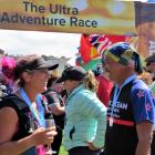 Alps 2 Ocean Ultra competitors enjoy a well-earned drink after crossing the finish line at Oamaru...