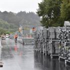 Construction on the temporary stand at the University of Otago Oval for the twenty20...