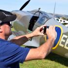 Ray van der Vliet, of Mosgiel, photographs a replica British Supermarine Spitfire MK 26 at the...