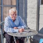 Enjoying the sun with a friend on Richill St, Belfast. "He doesn't talk much, and his jokes are...
