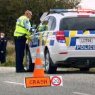 Emergency services work at the scene of a fatal motorcycle crash between Poolburn and Moa Creek...