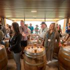 Otago Daily Times wine columnist Mark Henderson (centre left in checked shirt) at the Pinot Noir...