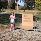Madison Wall (7), of Balclutha, outside the property of a neighbour who made her a sign and set...
