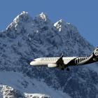 An Air New Zealand Airbus A320 passes the Remarkables on its way to land at Queenstown airport...