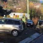 The van careered into parked cars, a power pole and a street sign. Photo: Guy Williams