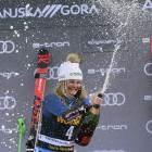 Champagne moment ... Queenstown teenager Alice Robinson celebrates after winning the giant slalom...