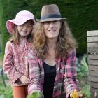 Michelle Cox and Hayley (6) with the different ingredients needed for a compost heap. PHOTOS:...