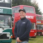 Parked up . . . Headfirst Travel co-owner Ralph Davies is surrounded by his business' buses at...
