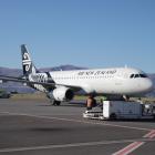 NZ1209 settles on the tarmac from Auckland. Photos: Hugh Collins