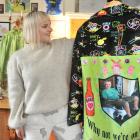 Ruby Van der Zanden, of Dunedin, holds a piece from her collection, a jacket with a photo of her...
