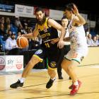 Otago Nuggets forward Jordan Ngatai is marked by Manawatu Jets guard Haize Walker during a...