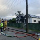 Fire crews at the scene of a house fire in Mataura today. Photo: Abbey Palmer