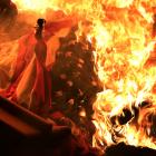 A US flag burns during a protest near the White House in response to the killing of George Floyd...