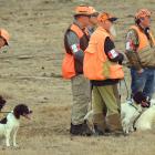 Competitors look on as they wait their turn to compete.  