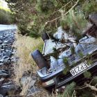 A car rolled on to its roof after coming off the road on State Highway 1, above Evansdale Glen,...