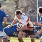 John McGlashan College's Harrison Morton runs the ball up against Southland Boys' High School at...