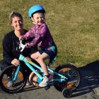 Grayson Wharerimu (4), supervised by his mum Jody, rides his new bike at Marlow Park in St Kilda...