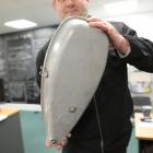 Waitaki District Council road safety co-ordinator Jason Evered holds a streetlight that was shot....