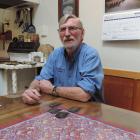 Colin Gibson, at his North Otago farmhouse table with shearing combs from New Zealand, Australia,...