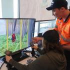 Hands on ... Josh Hurring, of Mike Hurring Logging and Contracting, helps Emiliano Heguaburu on a...