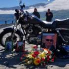 Tributes to Russell Allan Blackford laid alongside his now missing bike. Photo / NZ Police