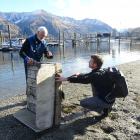 Wanaka Primary School teacher Markus Hermanns (right) learns about the Lake Wanaka marina
...