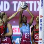 Steel shooter Kalifa McCollin lines up a shot under pressure from Tactix defenders Jane Watson ...